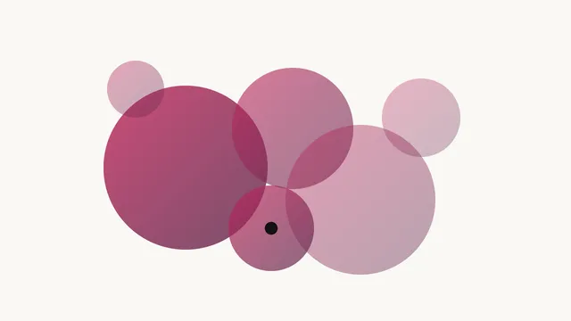 Overlapping rose-to-plum circles of different sizes on a paper background
